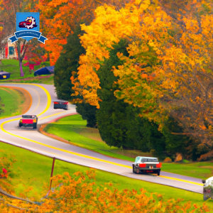 An image of a winding country road in Hedgesville, West Virginia, lined with colorful autumn leaves and a variety of cars driving by