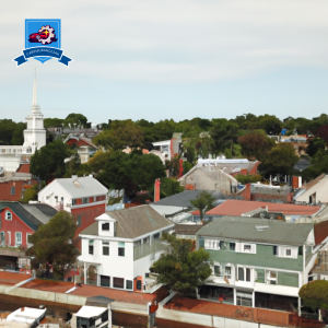 a serene coastal town in Rhode Island, with historic architecture, lush greenery, and pristine beaches