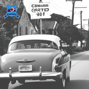 An image of a vintage car driving along the historic streets of Beaufort, South Carolina with a price tag hovering above it, symbolizing cheap car insurance options in the area