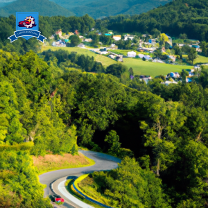 An image of a winding road through the lush green mountains of Kingwood, West Virginia, with a small town in the background and a car driving by