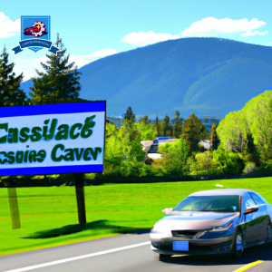 An image of a car driving on a scenic road in Marysville, Washington with a sign that reads "Cheapest Car Insurance in Marysville" in bold letters